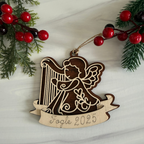 Wooden angel ornament with harp with personalization that is engraved by Cactus Air Designs.