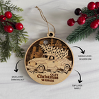 Wooden Christmas ornament with truck design and 'Cozy Christmas Wishes' text, surrounded by greenery and red berries.
