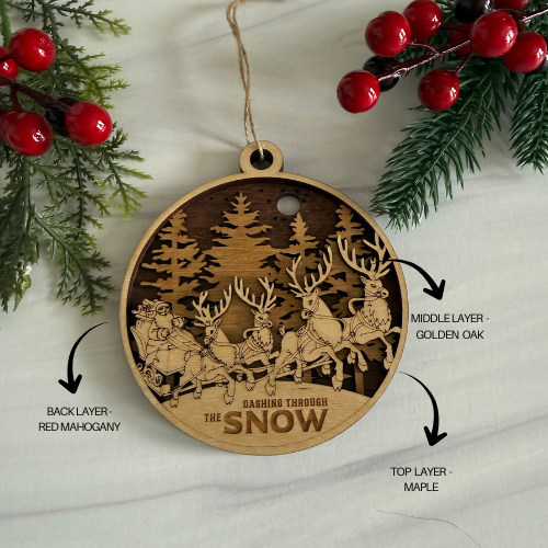 Wooden Christmas ornament with reindeer design, layered wood types labeled, on a white background with holly.