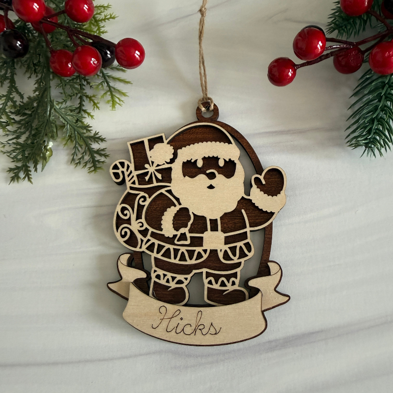 Wooden Santa Claus ornament with personalization made on Maple and Mahogany wood by Cactus Air Designs.
