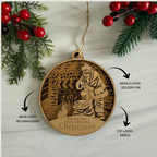 Wooden Christmas ornament with layered design and text, surrounded by festive decorations.