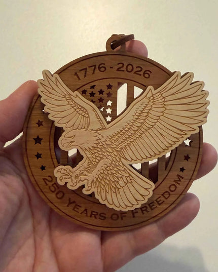 USA 250th anniversary American eagle flag wood ornament held in hand showing approximately 3.5 inch size