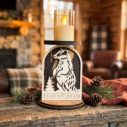 Layered plywood woodland badger candle holder with LED candle lit on a rustic wood surface in a cabin living room setting