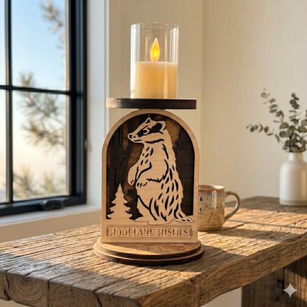 Layered plywood woodland badger candle holder on a rustic wood table with natural window light and coffee mug for scale