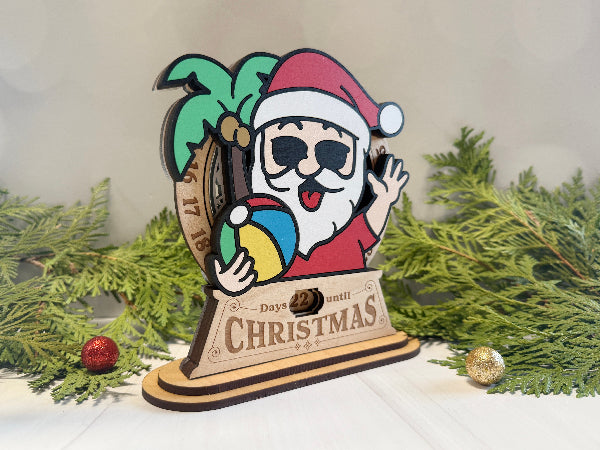Beach-themed Santa wooden Christmas countdown sign with palm tree design.