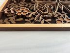 Side profile of 3D layered butterfly wood wall art showing the six-layer premium maple plywood construction and natural maple frame
