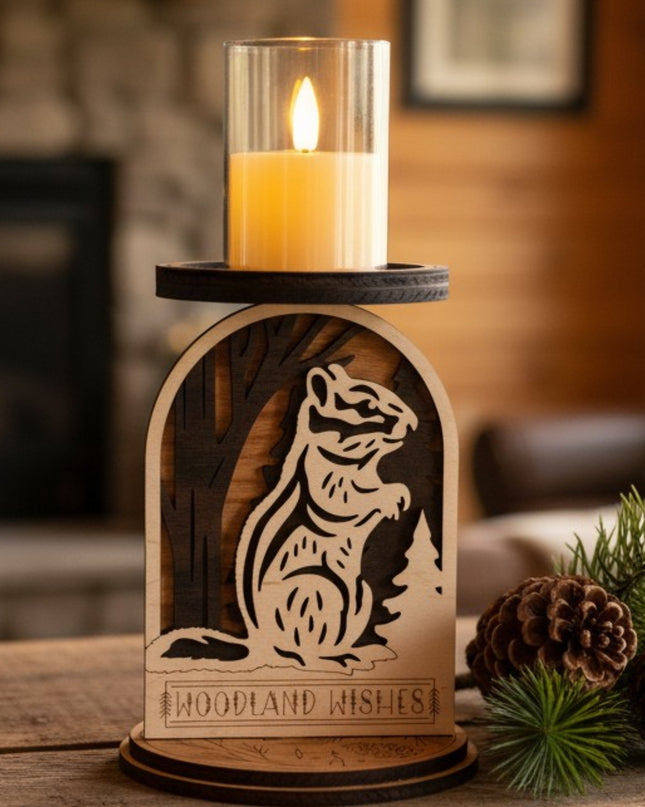 Candle holder with a squirrel design and 'Woodland Wishes' text, featuring a lit LED candle by Cactus Air Designs.