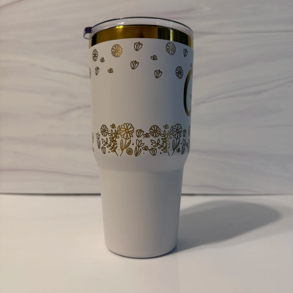 Side view of personalized white gold electroplated tumbler showing laser-engraved floral wrap design on 30 oz tumbler by Cactus Air Designs