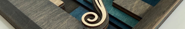 Close up of layered wood hummingbird wall art showing depth and laser cut detail