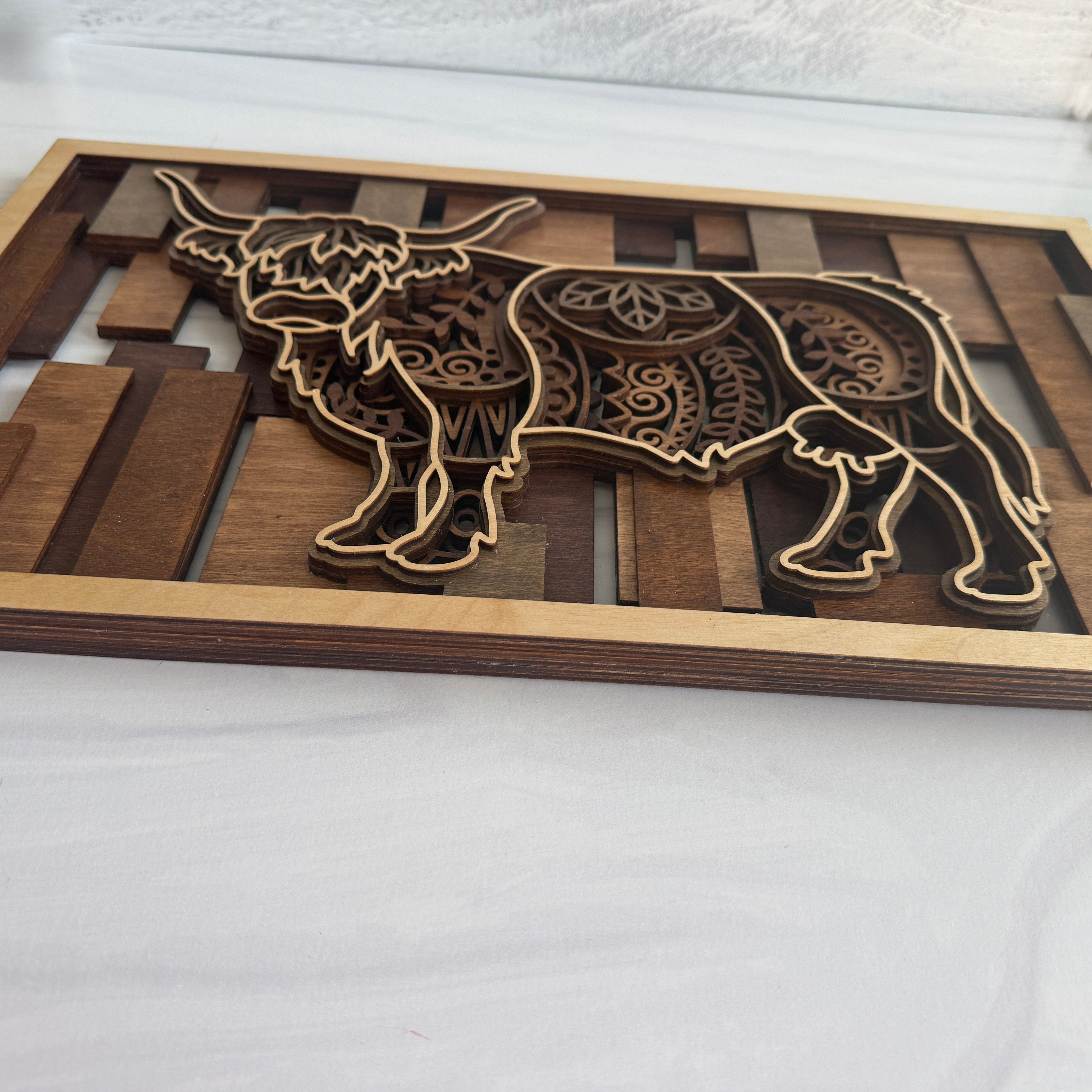 Cactus Air Designs 3D layered wood wall art featuring a Highland cow with intricate mandala patterns. Rustic farmhouse decor.