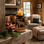Decorative candle holder with moose design on a wooden surface in a cozy living room by Cactus Air Designs.