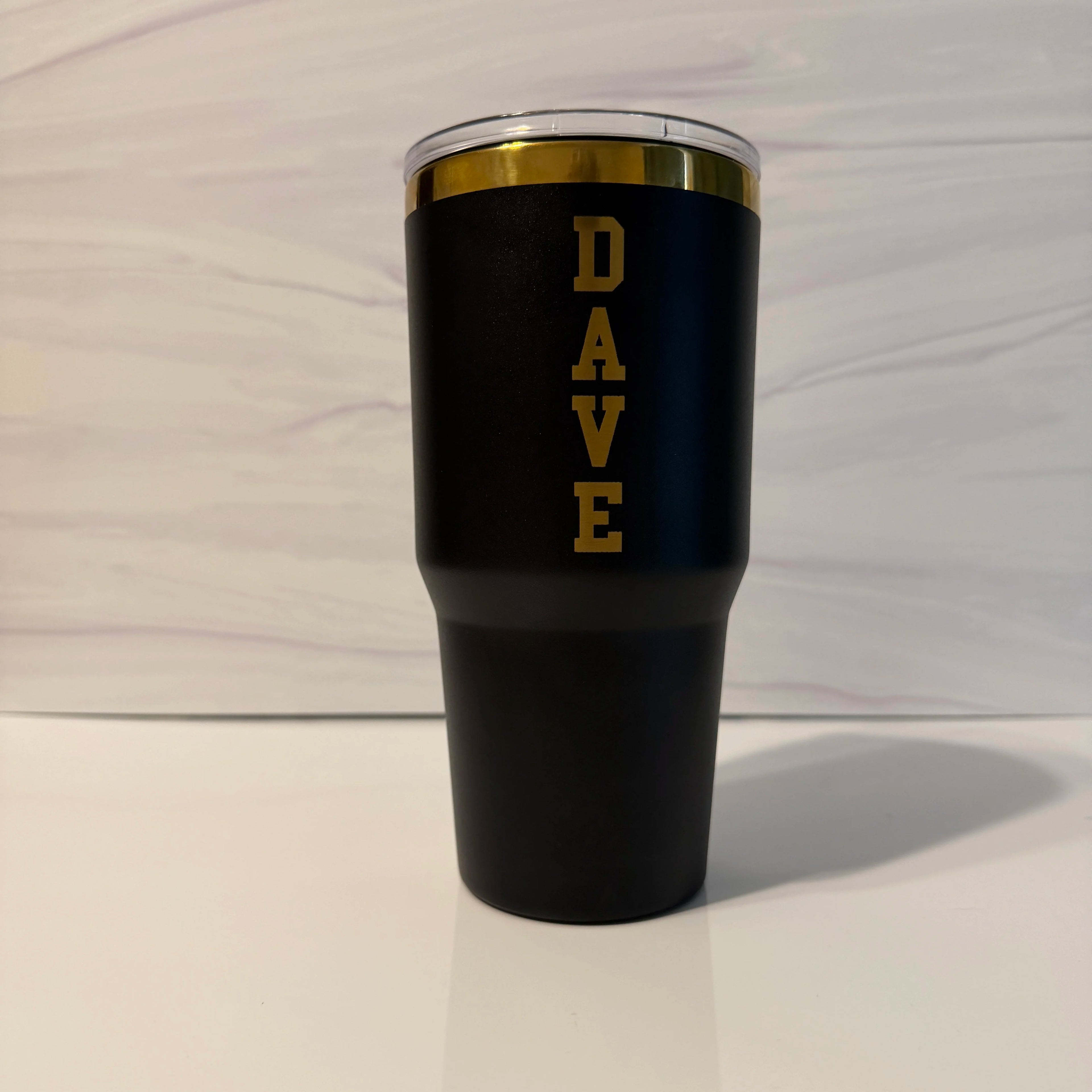 Black and gold electroplated 30 oz tumbler personalized with the name DAVE in vertical stacked letters, laser engraved by Cactus Air Designs
