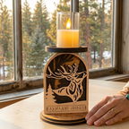 Hand placed next to laser-cut stag deer woodland candle holder showing 6.5 inch height, handcrafted wood decor by Cactus Air Designs
