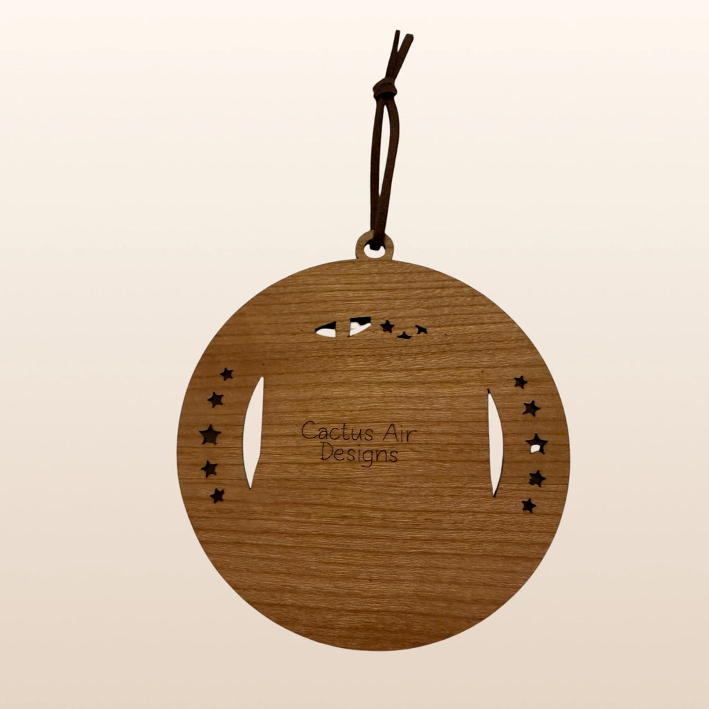 Back of USA 250th Anniversary Route 66 ornament showing Cactus Air Designs maker's mark on Premium Cherry plywood with leather cord hanger