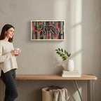 Cactus Air Designs 3D layered wood wall art featuring a geometric wolf in red, black, and grey wood on a gray wall above a wood console table with a woman holding coffee mug.