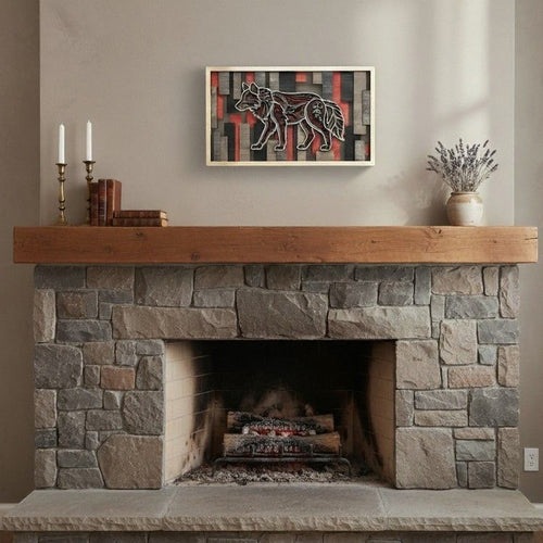 Cactus Air Designs 3D layered geometric wolf wood wall art with red and grey accents on a wall above a fireplace.