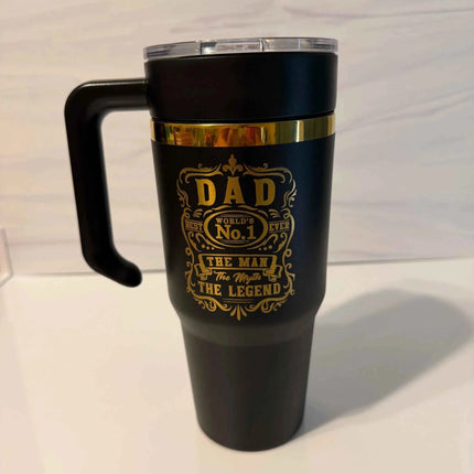 30 oz black powder coated electroplated tumbler with handle showing gold laser engraved Dad the Man the Myth the Legend design
