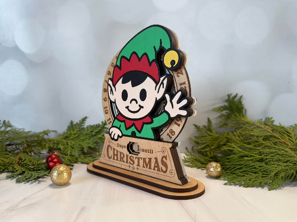 Laser-cut elf character wooden Christmas countdown with engraved numbers.