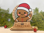Wooden Christmas countdown stand with gingerbread man design and festive decorations.