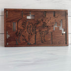 Back of layered Highland Cow wood wall art showing built-in wall hanger and stained wood backing that highlights the laser-cut geometric patterns