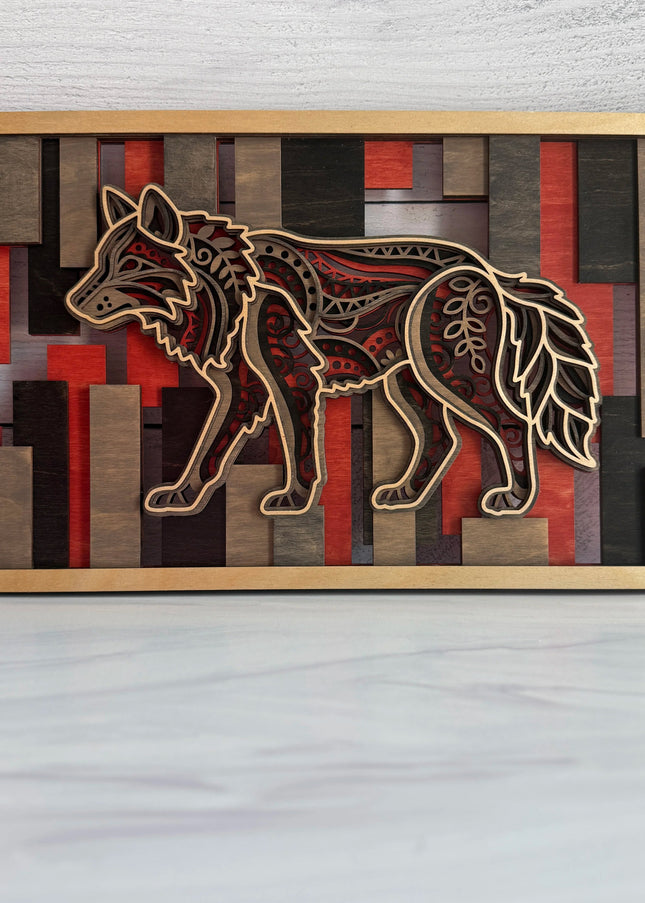 Wolf layered wood wall art front view showing mandala wolf design in Cactus Bloom and Midnight Mesa stained plywood with geometric rectangular mosaic background
