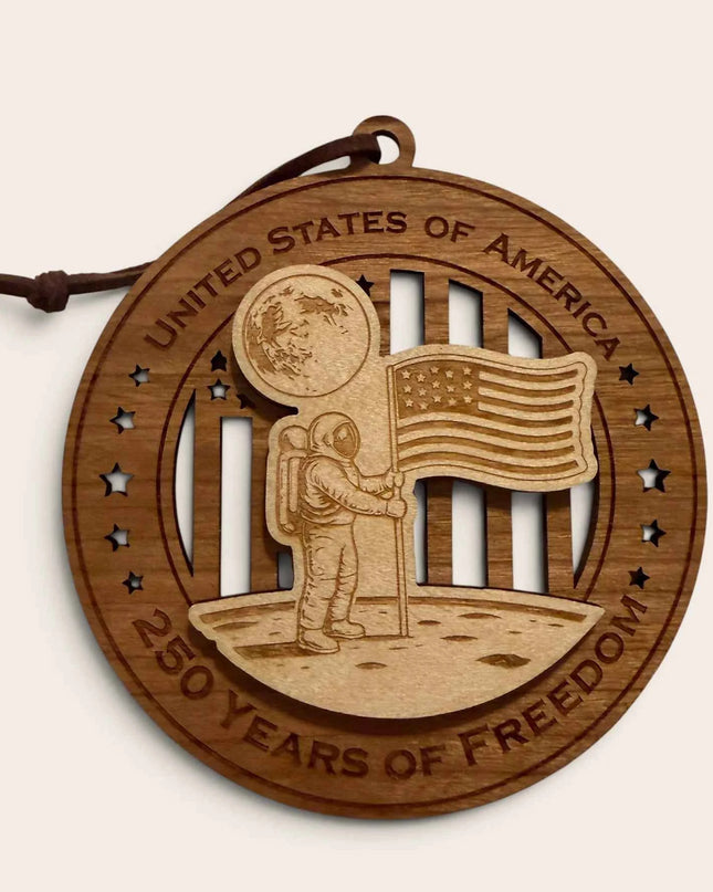 Front view of Moon Landing 250 Years of Freedom laser cut wood ornament showing astronaut and American flag on lunar surface