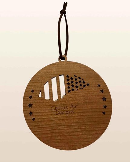 Back of Mount Rushmore USA 250th anniversary wood ornament showing cherry plywood layer and Cactus Air Designs branding
