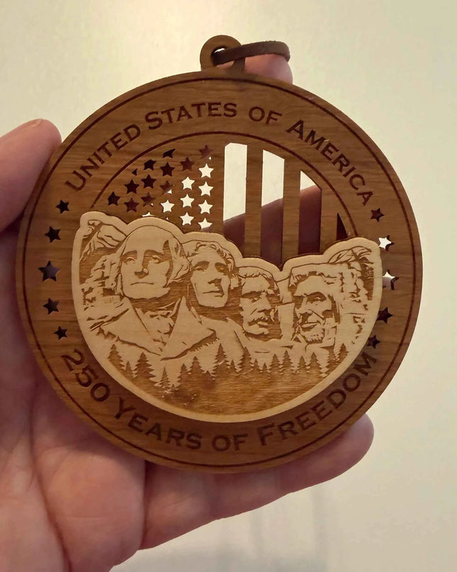 Detailed view of Mount Rushmore 250 Years of Freedom laser cut wood ornament showing four presidents carved into mountain design