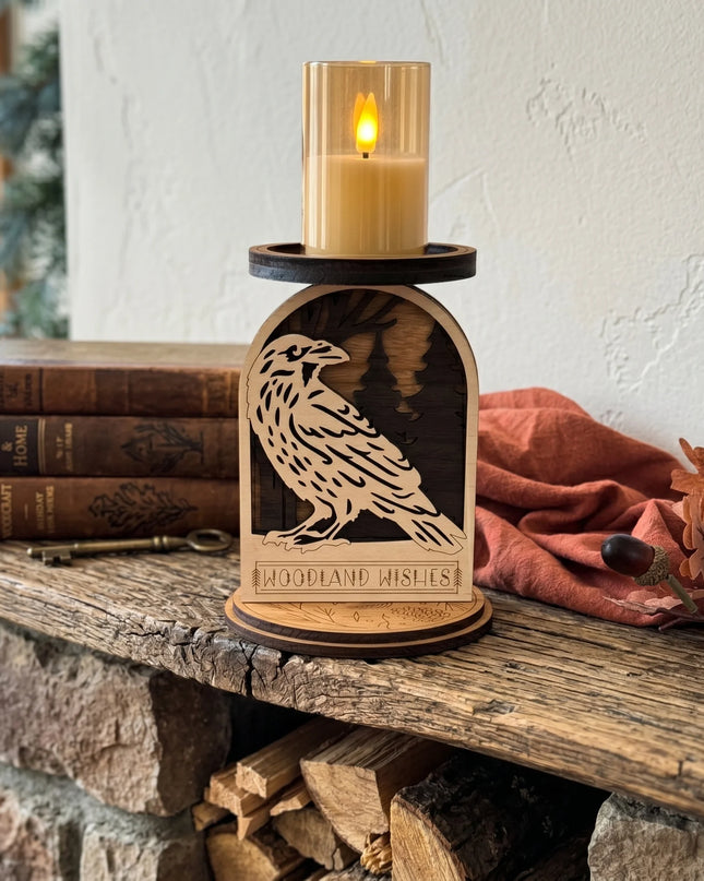 Wooden candle holder with a raven design on a fireplace mantle with vintage books and a LED lit candle.