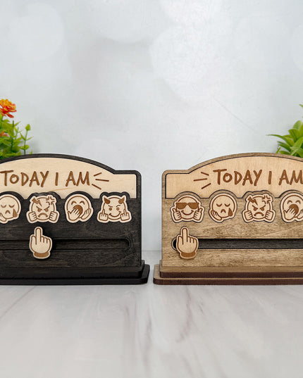 Two handcrafted wood Today I Am emoji mood boards shown side by side in black stain and natural finishes