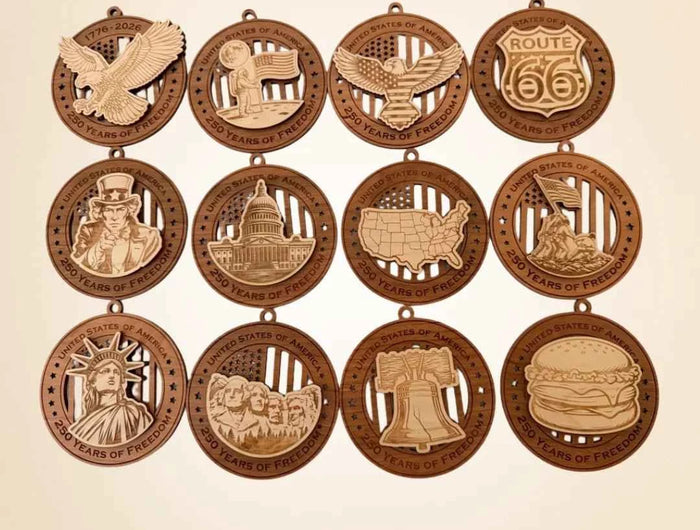 Full collection of 12 USA 250th Anniversary laser cut wood ornaments showing all designs including eagle, Liberty Bell, Mount Rushmore, Statue of Liberty, Uncle Sam, Capitol Building, Route 66, Moon Landing, Iwo Jima, USA map, Liberty Bell, and cheeseburger