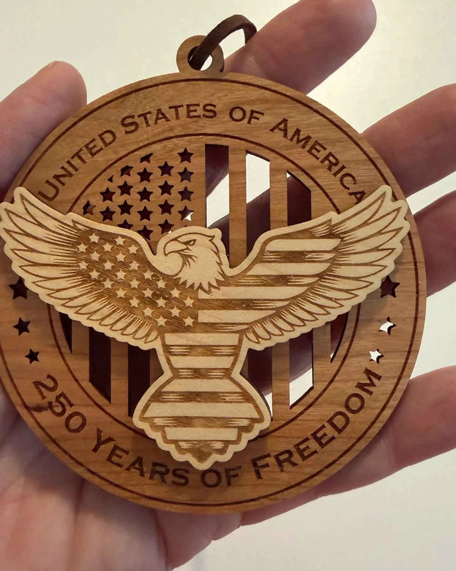 Scale view of Eagle Flag Shield 250 Years of Freedom laser cut wood ornament with bald eagle and American flag design
