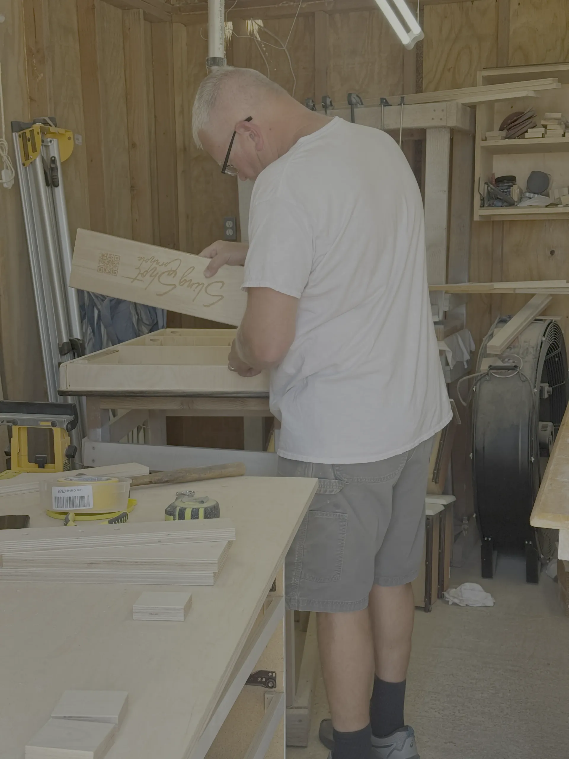 Gene, co-owner of Cactus Air Designs, in his woodworking workshop in Arizona