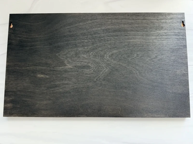 Back of the closed-back layered wood wall art with two pre-installed keyhole hangers.
