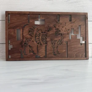 Back view of highland cow wall art showing Desert Walnut closed backer, cutout silhouette, and keyhole hangers