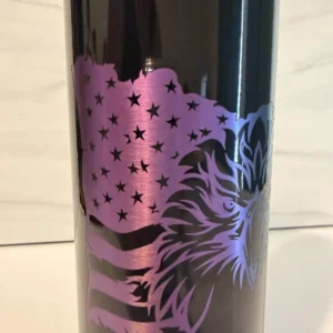 Close-up of laser-engraved American flag and stars on black electroplated 20 oz skinny tumbler with purple and rainbow metallic reveal