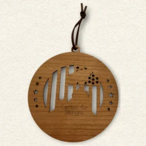 Back of the round wooden ornament showing the natural wood grain, an attached brown hanging cord, and “Cactus Air Designs” laser engraved in a delicate single-line font.