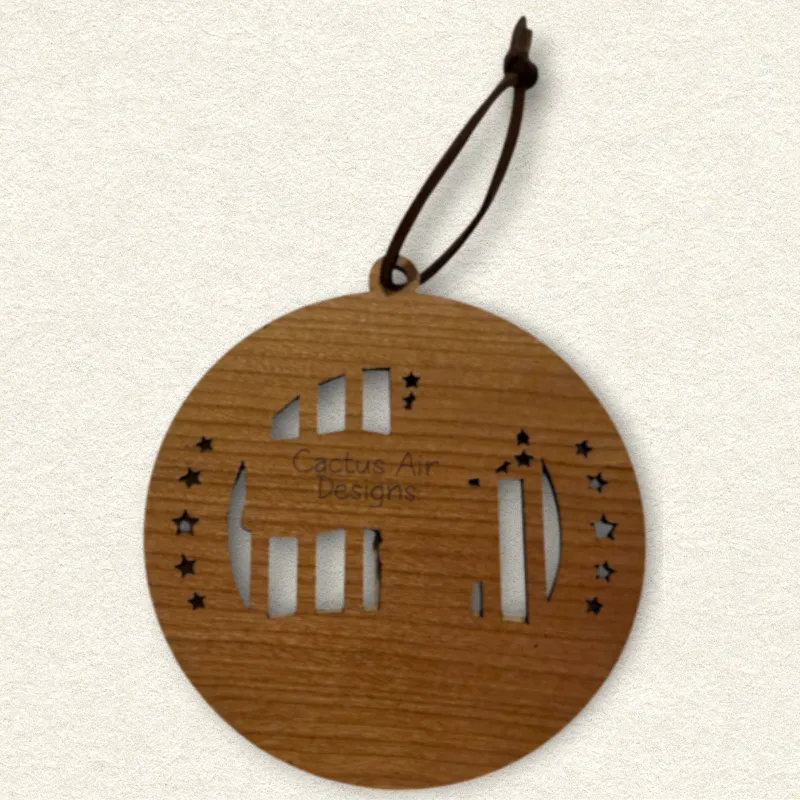 Back of the round wooden ornament showing the natural wood grain, an attached brown hanging cord, and “Cactus Air Designs” laser engraved in a delicate single-line font.