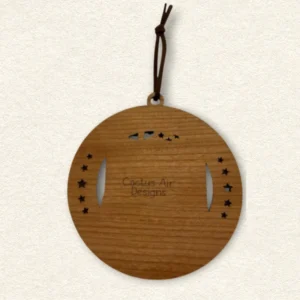 Back of the round wooden ornament showing the natural wood grain, an attached brown hanging cord, and “Cactus Air Designs” laser engraved in a delicate single-line font.