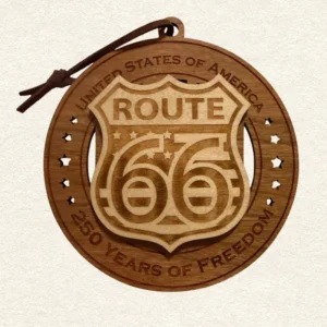 usa-250-route-66-wood-ornament-front • Cactus Air Designs Round two-layer wooden ornament with "United States of America" and "250 Years of Freedom" engraved on the border, featuring a laser-cut flag with cut-through stripes and star field, topped with a detailed Route 66 shield, hung on a brown cord