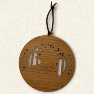 Back of the round wooden ornament showing the natural wood grain, an attached brown hanging cord, and “Cactus Air Designs” laser engraved in a delicate single-line font.