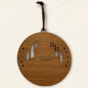 Back of the round wooden ornament showing the natural wood grain, an attached brown hanging cord, and “Cactus Air Designs” laser engraved in a delicate single-line font.