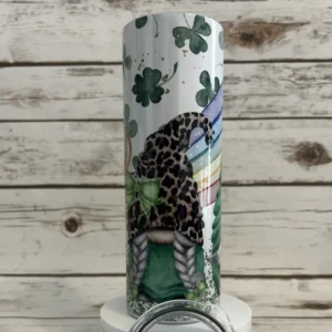 20 oz White Shimmer skinny tumbler with braided pigtail gnome, green plaid bow and leopard print hat.