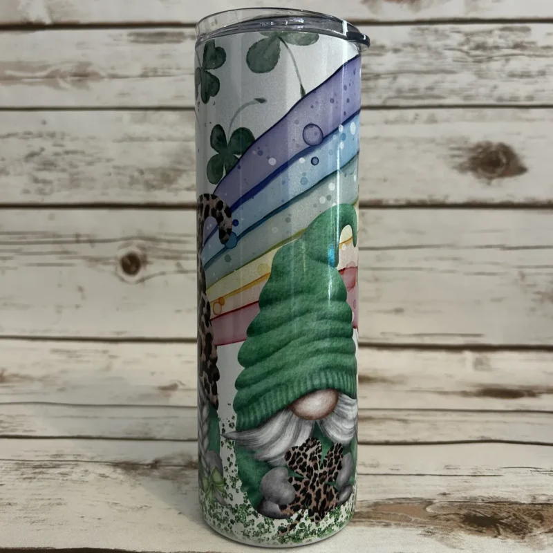 Close-up view of St. Patrick’s Day tumbler showcasing bearded gnome in a green knit hat and gold shamrock details