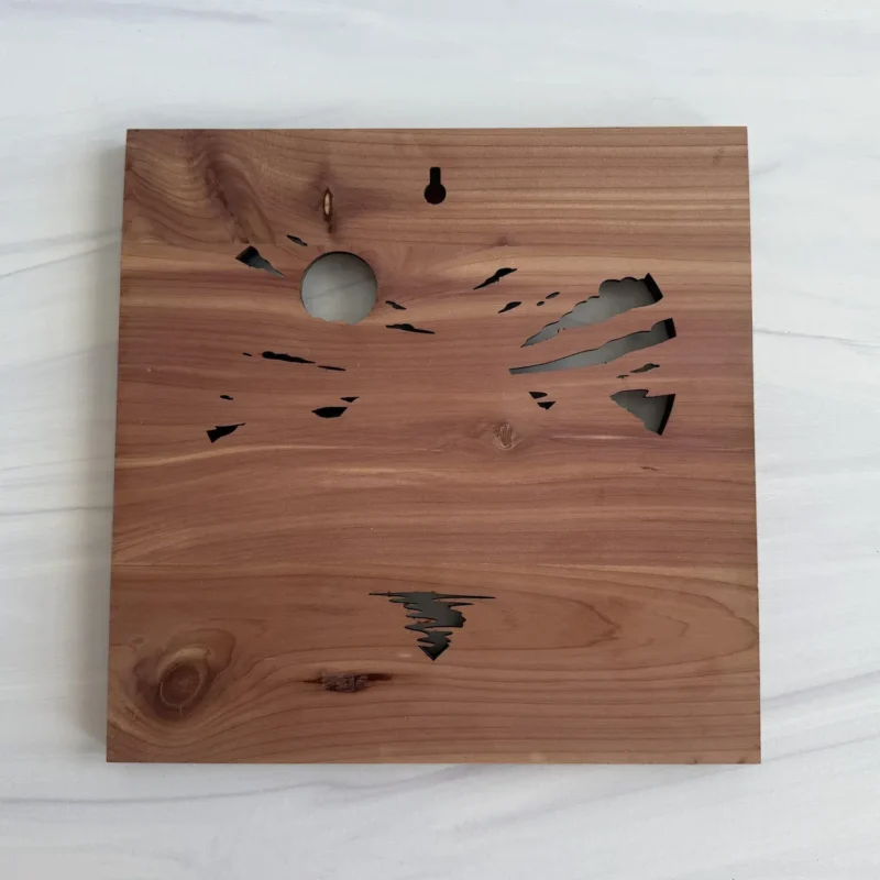 Aromatic cedar back with keyhole hanging opening and landscape cutouts