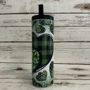 st patricks day gorgeous green heart tumbler that has green buffalo plaid with a sublimated design on a 20oz skinny