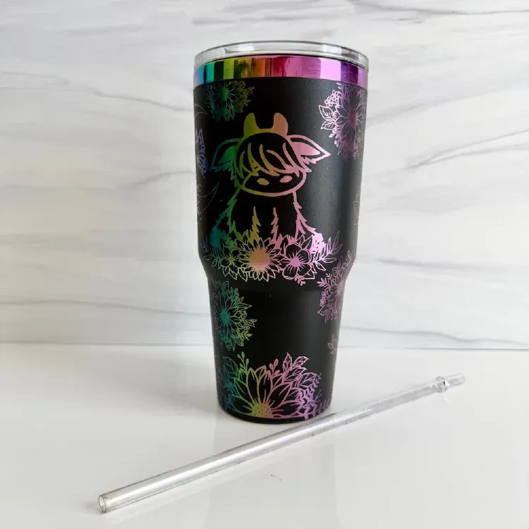 Personalized white and gold electroplated tumbler with hand drawn flowers with a name all engraved.